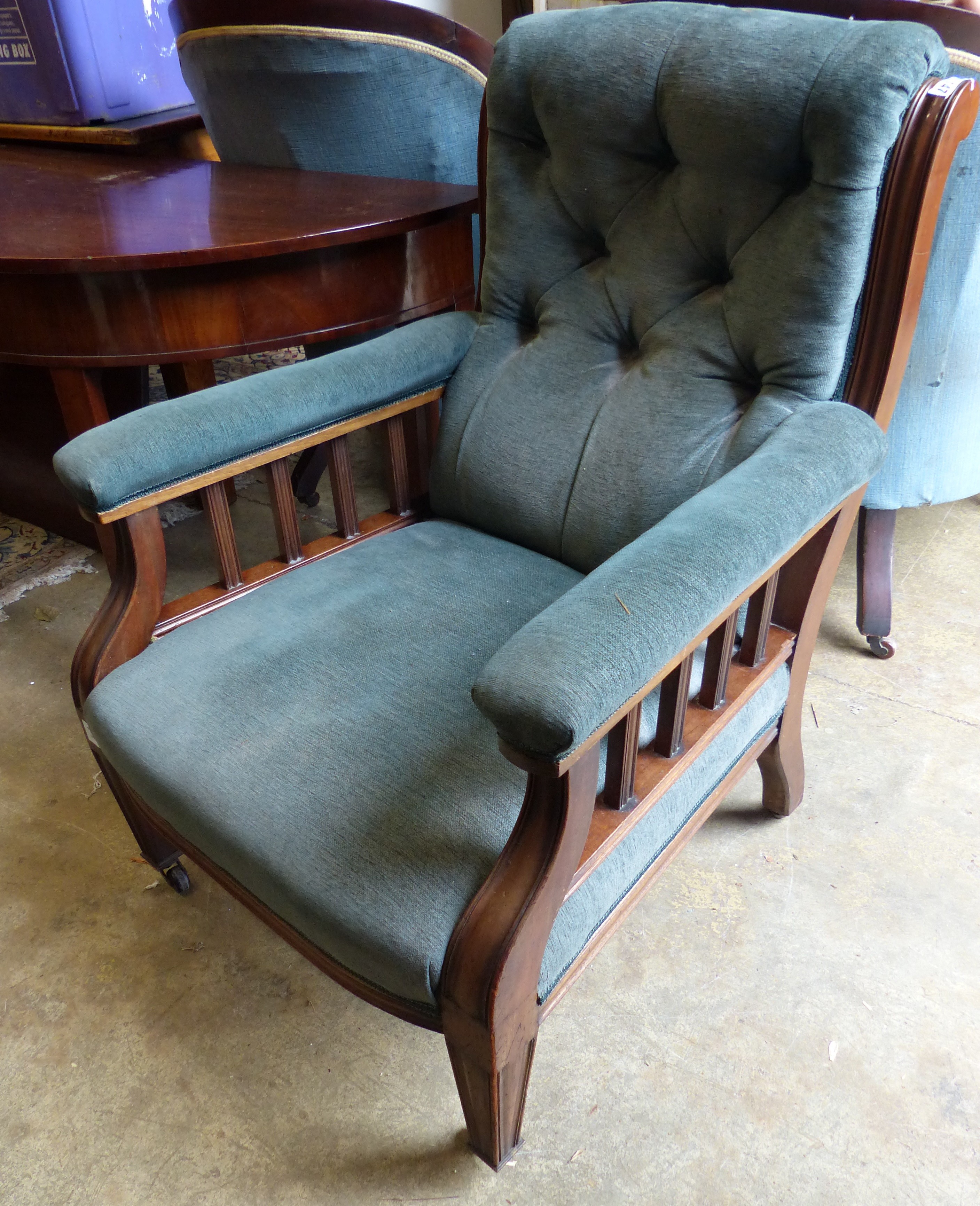 A Victorian mahogany open armchair.